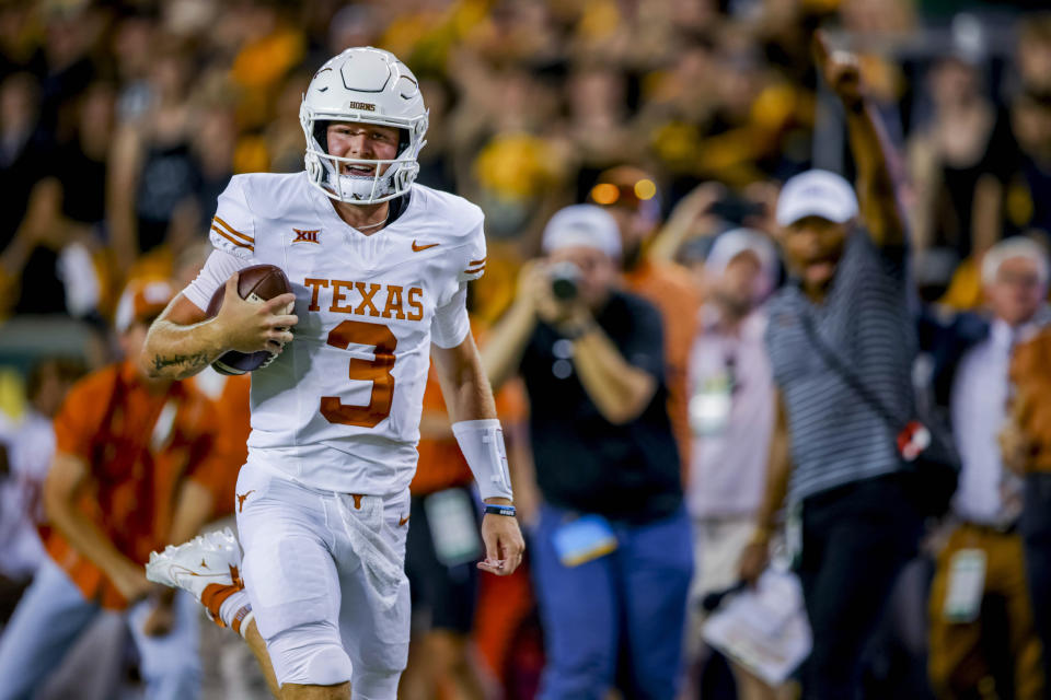 Texas quarterback Quinn Ewers (3) runs for a touchdown against Baylor during the first half of an NCAA college football game Saturday, Sept. 23, 2023, in Waco, Texas. (AP Photo/Gareth Patterson)