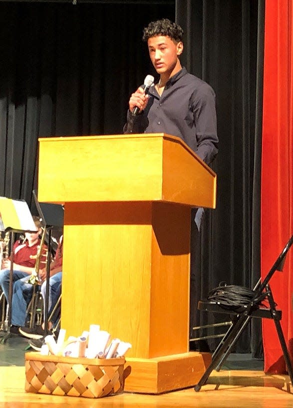 Licking Heights Middle School eighth grader Reinaldo Perez Bonilla reads a thank you letter to veterans during the school's Veterans Day program Nov. 10.