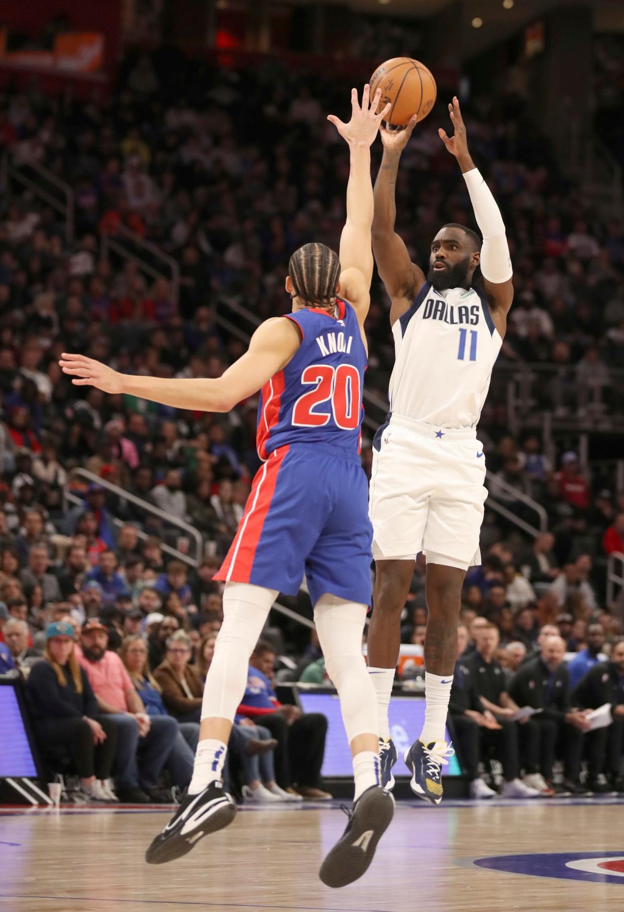 Detroit Pistons forward Kevin Knox II (20) defends against Dallas Mavericks forward Tim Hardaway Jr. (11) during fourth-quarter action at Little Caesars Arena in Detroit on Thursday, Dec. 1, 2022.