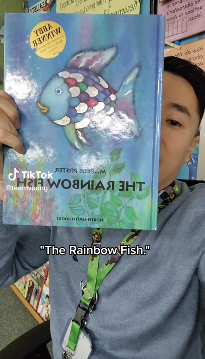 Screenshot from TikTok by @teamvuong of a copy of the book Rainbow Fish