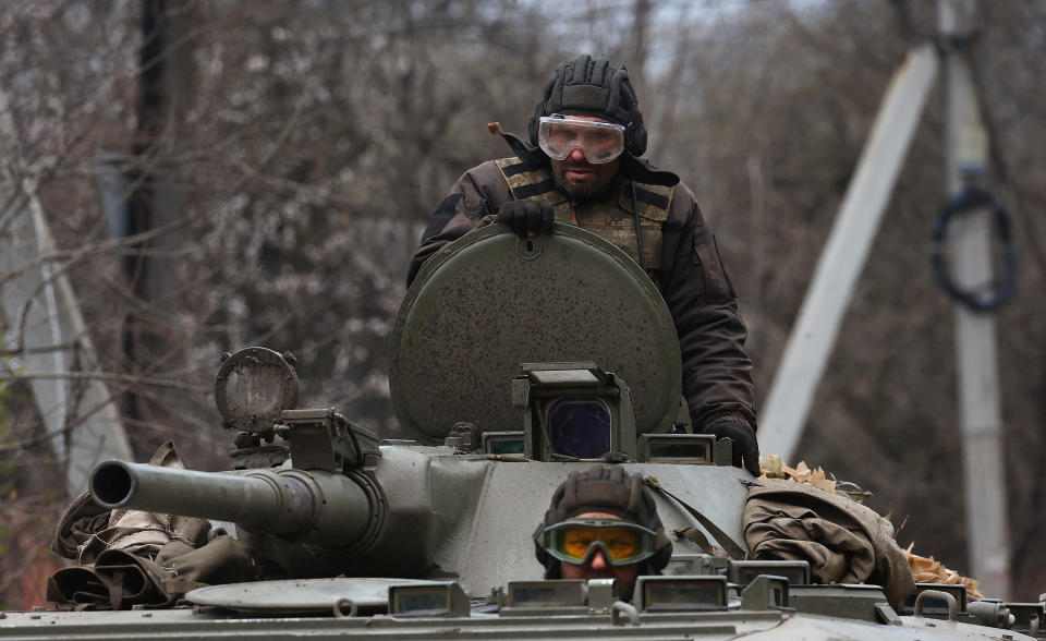 Ukrainian servicemen drive towards the frontline during heavy fighting at the frontline of Bakhmut and Chasiv Yar, in Chasiv Yar, Ukraine, April 12, 2023.  REUTERS/Kai Pfaffenbach