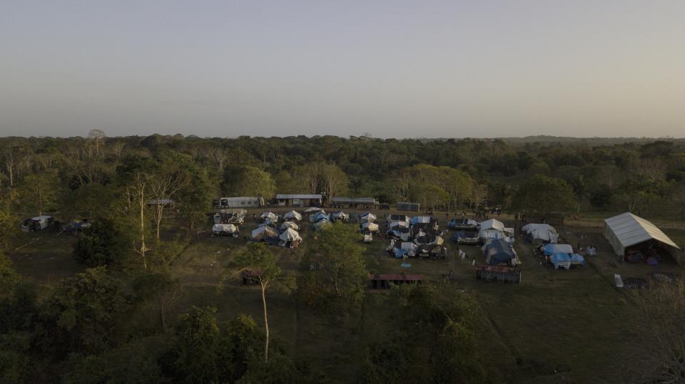 Tents stand at a migrant camp amid the new coronavirus pandemic in San Vicente, Darien province, Panama, Tuesday, Feb. 9, 2021. Panama is allowing hundreds of migrants stranded because of the pandemic, to move to the border with Costa Rica, after just reopening its land borders. (AP Photo/Arnulfo Franco)