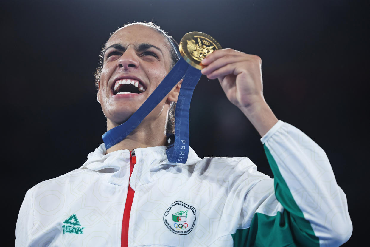 PARIS, FRANCE - AUGUST 09: Gold Medallist Imane Khelif of Team Algeria celebrates with her medal during the Boxing Women's 66kg medal ceremony after the Boxing Women's 66kg Final match on day fourteen of the Olympic Games Paris 2024 at Roland Garros on August 09, 2024 in Paris, France. (Photo by Richard Pelham/Getty Images)