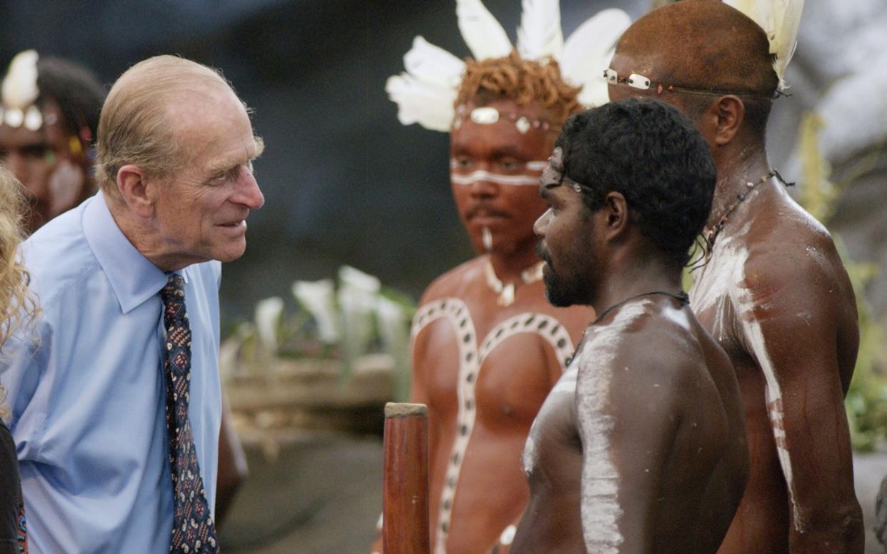 The Duke of Edinburgh talks to Aboriginal performers after watching a culture show at Tjapukai Aboriginal Culture Park, Cairns in 2002 - PA