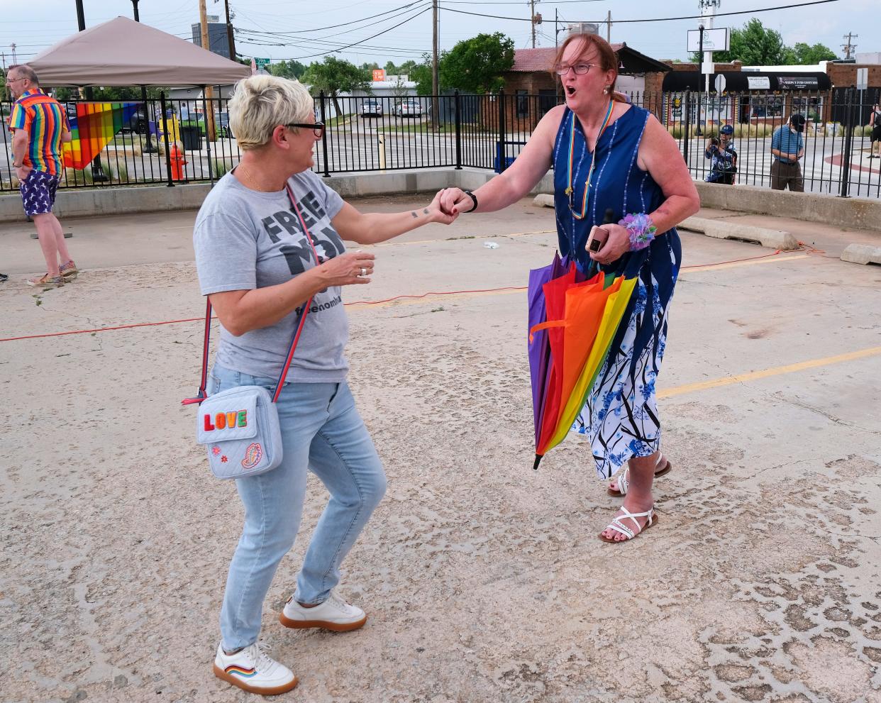 Sara Cunningham, founder of "Free Mom Hugs," left, dances with Diana Lettkeman at this week's OKC Pride Opening Ceremony in Oklahoma City's historic 39th District.