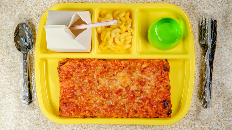 yellow tray with milk mac and cheese and pizza