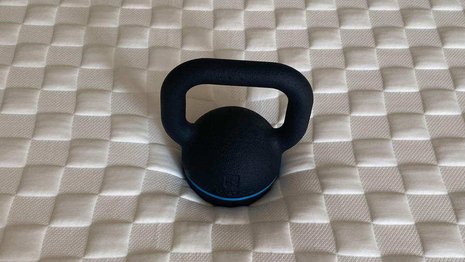 A kettlebell on the Levitex Gravity Defying Mattress