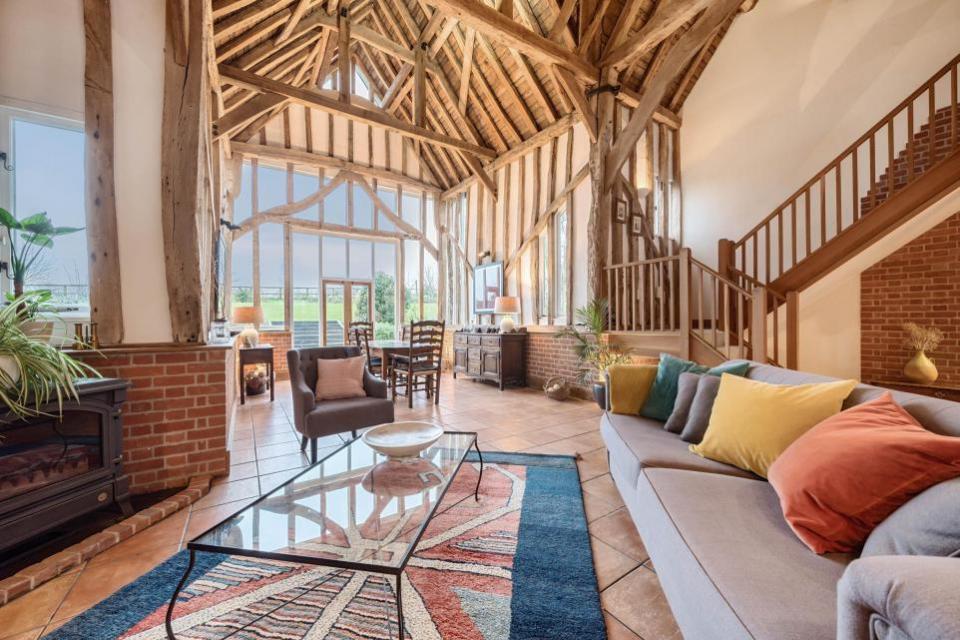 East Anglian Daily Times: The vaulted reception/dining hall features an exposed timber frame and large glazed rear gable