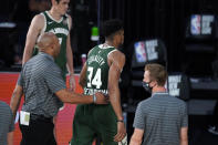 Milwaukee Bucks' Giannis Antetokounmpo (34) heads to the locker room after being ejected during the first half of an NBA basketball game against the Washington Wizards, Tuesday, Aug. 11, 2020, in Lake Buena Vista, Fla. (AP Photo/Ashley Landis, Pool)