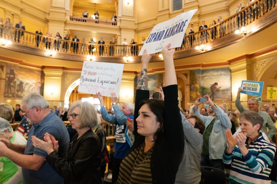 Medicaid expansion supporters hold signs during a rally at the Statehouse on March 6. Two weeks later, the Legislature held its first public hearings on expanding Medicaid since 2020.