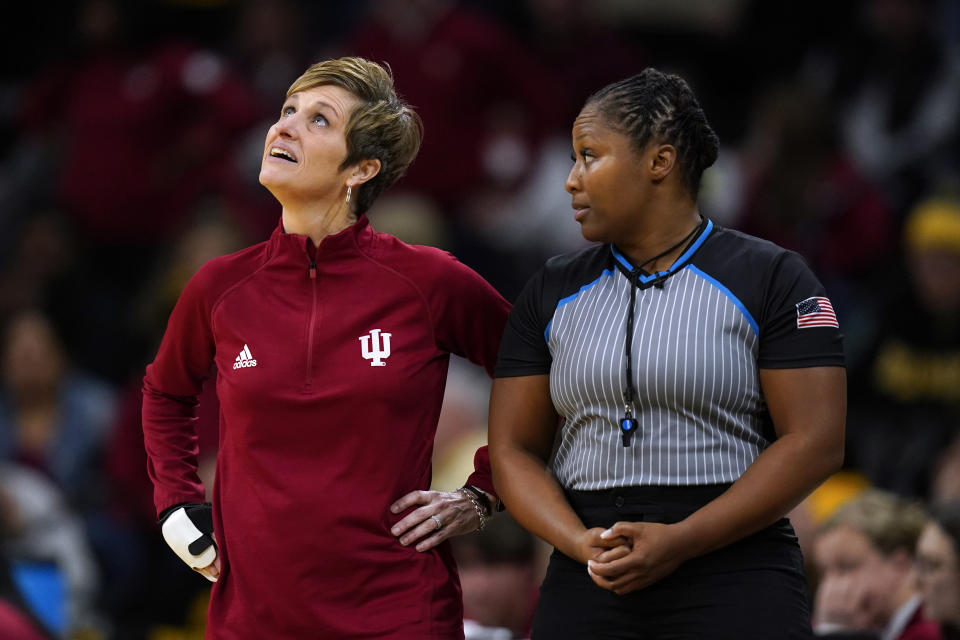 Indiana head coach Teri Moren, left, talks with an official during the second half of an NCAA college basketball game against Iowa, Sunday, Feb. 26, 2023, in Iowa City, Iowa. Iowa won 86-85. (AP Photo/Charlie Neibergall)