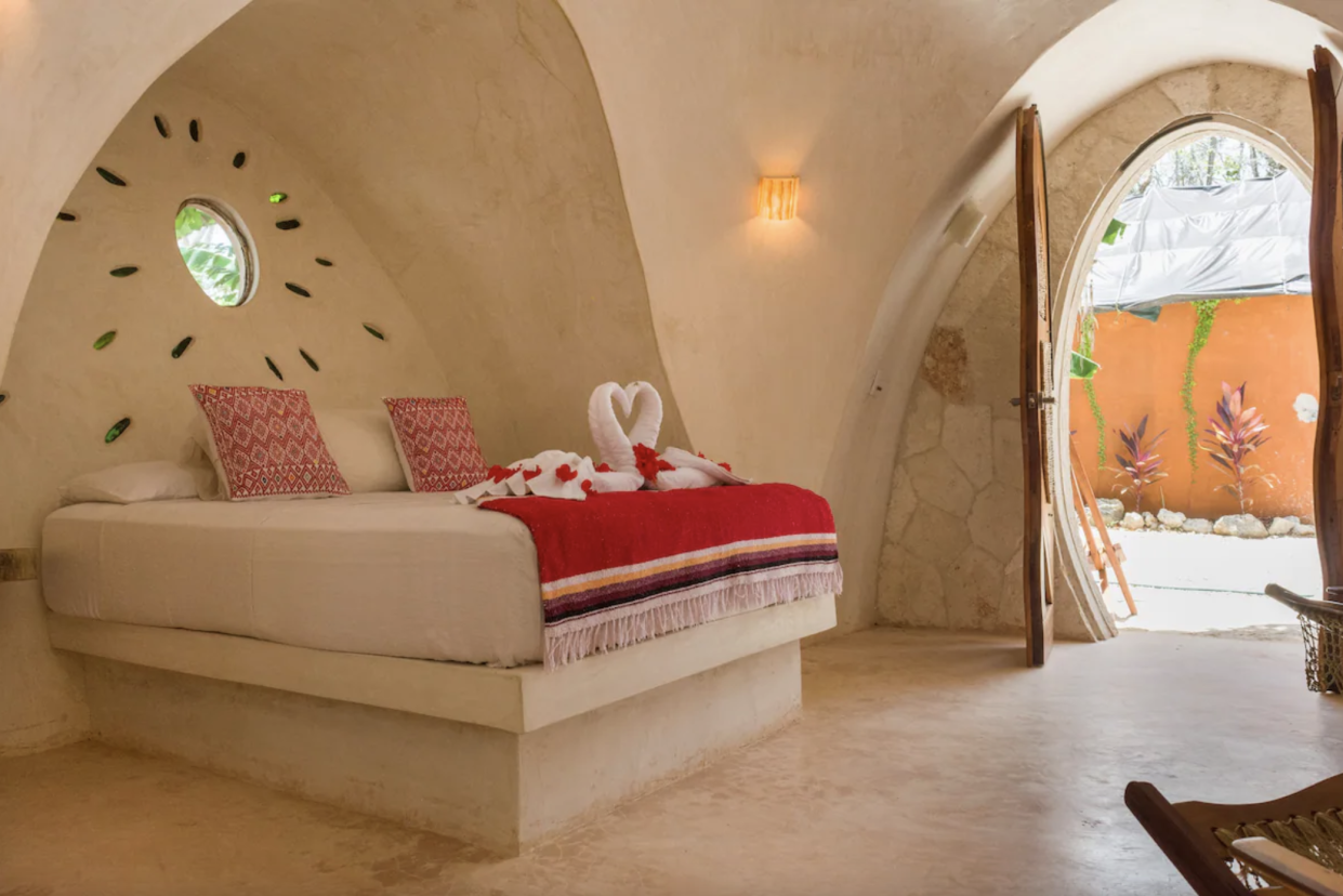 Eco-Lush Mayan Dome bed with pillows decorations and door open