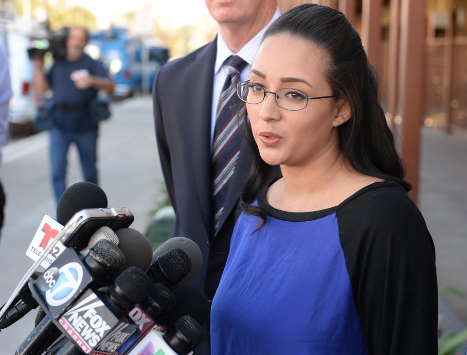 In this Monday, Jan. 20, 2014 photo, a woman who wanted to be identified by her first name, Jamie, speaks at a news conference in front of Alhambra High School in Alhambra, Calif., where Andrea Cardosa last worked as vice principal of student services. Police in Riverside, Calif., are investigating allegations from her and another woman, who say Cardosa, a former middle school teacher and administrator, abused them while they were students in Riverside County. (AP Photo/The Pasadena Star-News, Keith Durflinger) MAGS OUT; NO SALES; MANDATORY CREDIT