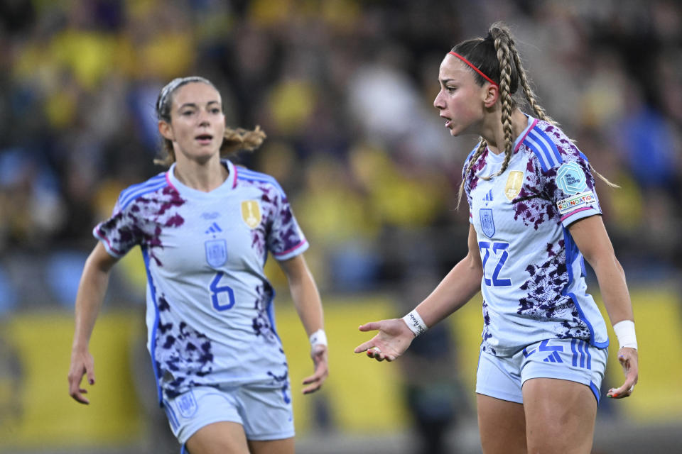 Spain's Athenea del Castillo, right, celebrates with Aitana Bonmati after scoring during the Women's Nations League soccer match between Sweden and Spain at Gamla Ullevi in Gothenburg, Sweden, Friday Sept. 22, 2023. (Bjorn Larsson Rosvall/TT News Agency via AP)