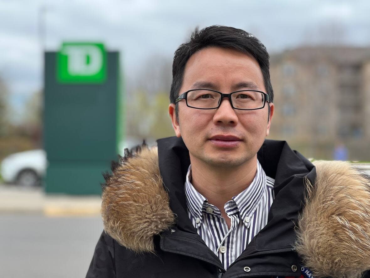Guanghu Cui of Oakville, Ont., refused to sign a non-disclosure agreement to get financial compensation in a dispute with his bank, calling the requirement 'unethical.'  (Dave MacIntosh/CBC - image credit)