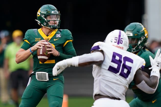 UAlbany's AJ Simon (96) pursues Baylor quarterback Blake Shapen in a 2022 game at Waco, Texas.