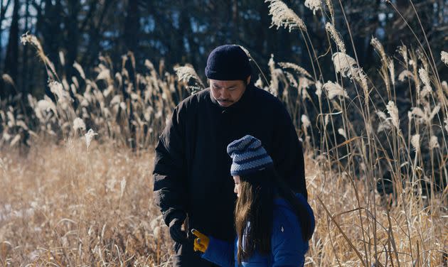 Takumi (Hitoshi Omika) and his daughter Hana (Ryo Nishikawa) in a scene from 