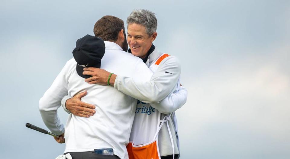 Scottie Scheffler and his caddie, Ted Scott, embrace each other following Scheffler’s victory after a rain delay pushed the final round of the RBC Heritage Presented by Boeing at Harbour Town Golf Links to Monday, April 22, 2024 in Sea Pines on Hilton Head Island.