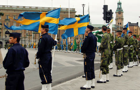 FILE PHOTO: Swedish armed forces soldiers attend a rehearsal in front of the Royal Palace in Stockholm, Sweden June 18, 2010. REUTERS/Fabrizio Bensch/File Photo