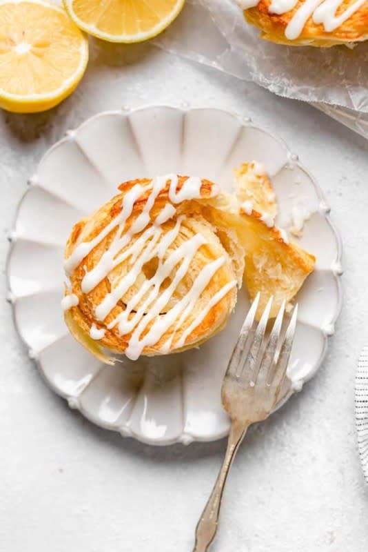 <p>Grandbaby Cakes</p><p>Made with a flaky biscuit dough, a sugary citrus filling and a zippy cream cheese drizzle, this Lemon Cinnamon Rolls biscuit recipe are a deliciously perfect way to enjoy a classic pastry in a new and exciting flavorful way WITH NO YEAST!</p><p><strong>Get the recipe: <a href="https://grandbaby-cakes.com/lemon-cinnamon-rolls/" rel="nofollow noopener" target="_blank" data-ylk="slk:Lemon Cinnamon Rolls;elm:context_link;itc:0;sec:content-canvas" class="link ">Lemon Cinnamon Rolls</a></strong></p>