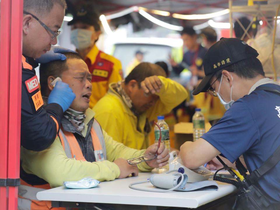 Two trapped workers of Taroko National Park have a physical examination after being rescued (AP)