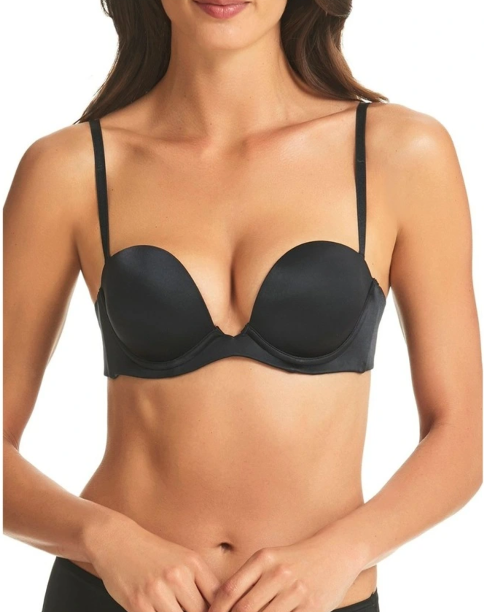 A model wears a black 6 Way Low Cut Strapless Convertible Bra with matching briefs