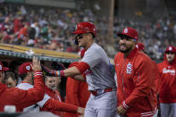 St. Louis Cardinals' Lars Nootbaar, center, celebrates with teammates in the dugout after scoring against the Oakland Athletics on Willson Contreras' double during the sixth inning of a baseball game Monday, April 15, 2024, in Oakland, Calif. (AP Photo/Godofredo A. Vásquez)