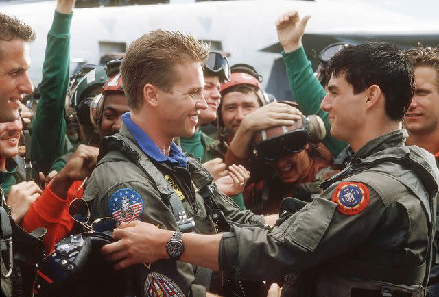 Paramount/Kobal/Shutterstock Val Kilmer and Tom Cruise in 1986's Top Gun