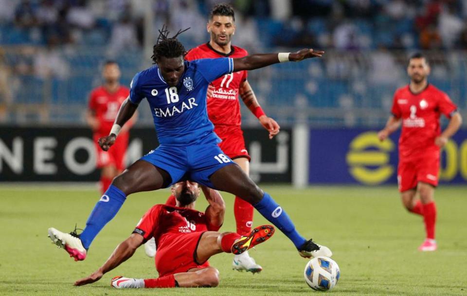 Al-Hilal’s Bafétimbi Gomis is at the centre of the action during the AFC Champions League quarter-final win over Iran’s Persepolis.