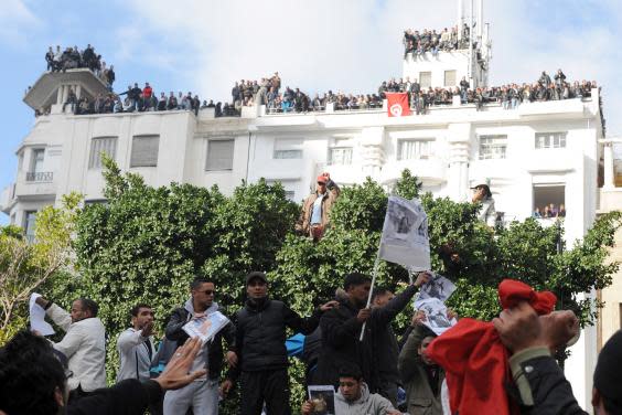 Demonstrators gather in front of the interior ministry in Tunis demanding Ben Ali resign in January 2011 (AFP/Getty)