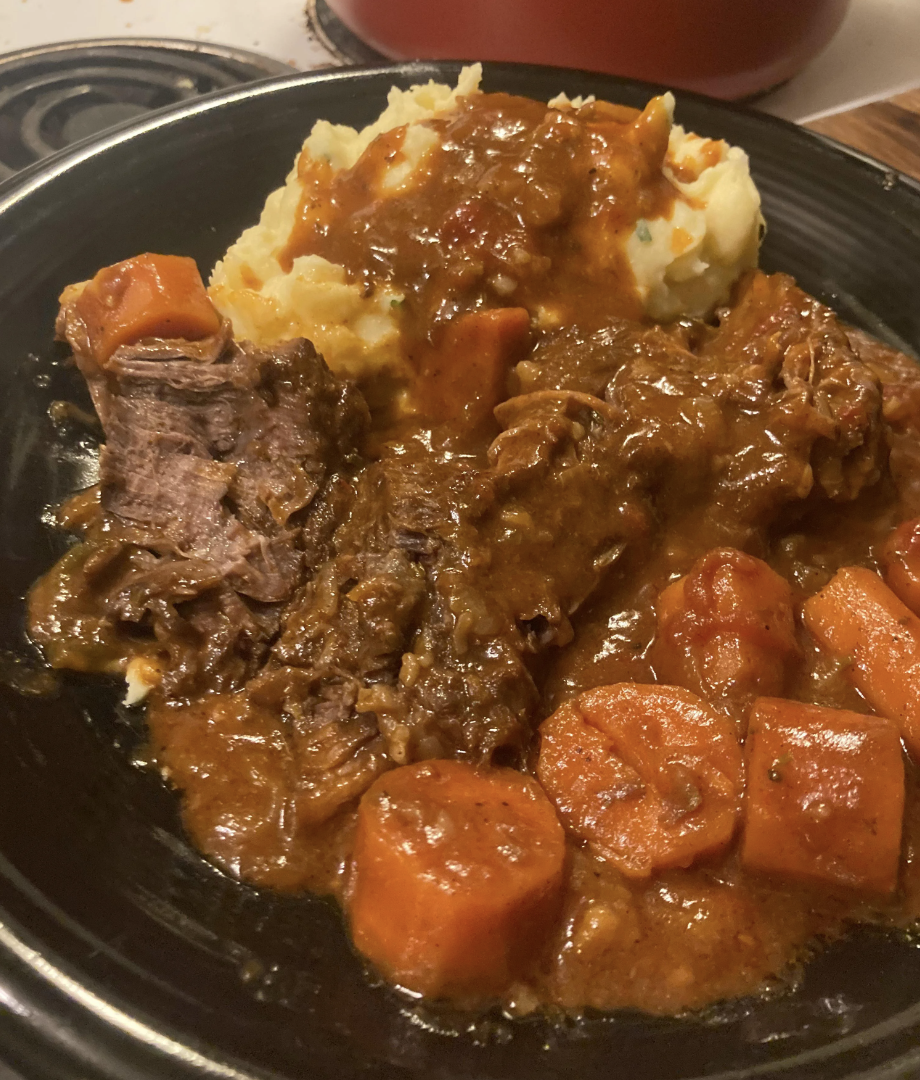 Pot roast with carrots and mashed potatoes.