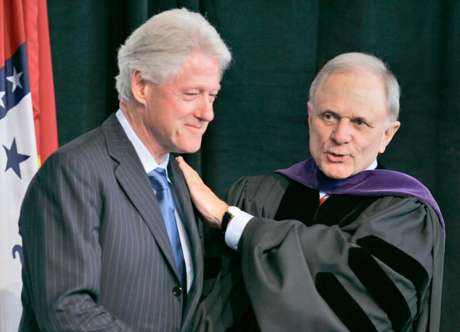 FILE – Former President Bill Clinton, left, is greeted by David Pryor, former senator and past dean of the University of Arkansas Clinton School of Public Service, Dec. 13, 2006, in Little Rock, Ark., after Clinton spoke to the first graduating class of the school. Former Arkansas governor and U.S. Sen. David Pryor, a Democrat who was one of the state’s most beloved political figures and remained active in public service in the state long after he left office, has died. He was 89. (AP Photo/Danny Johnston, File)