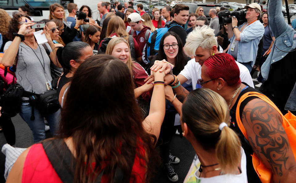 <p>Students who survived the shooting at Stoneman Douglas High School, along with survivors of the Pulse nightclub shooting, cheer before the students board a bus in Parkland, Fla., Tuesday, Feb. 20, 2018, to rally outside the state capitol and talk to legislators about gun control reform. The students plan to hold a rally Wednesday in hopes that it will put pressure on the state’s Republican-controlled Legislature to consider a sweeping package of gun-control laws, something some GOP lawmakers said Monday they would consider. (Photo: Gerald Herbert/AP) </p>