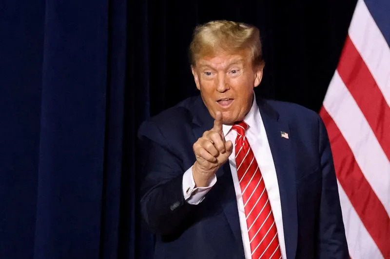 FILE PHOTO: Former U.S. President Trump hosts a campaign rally, in Rome, Georgia