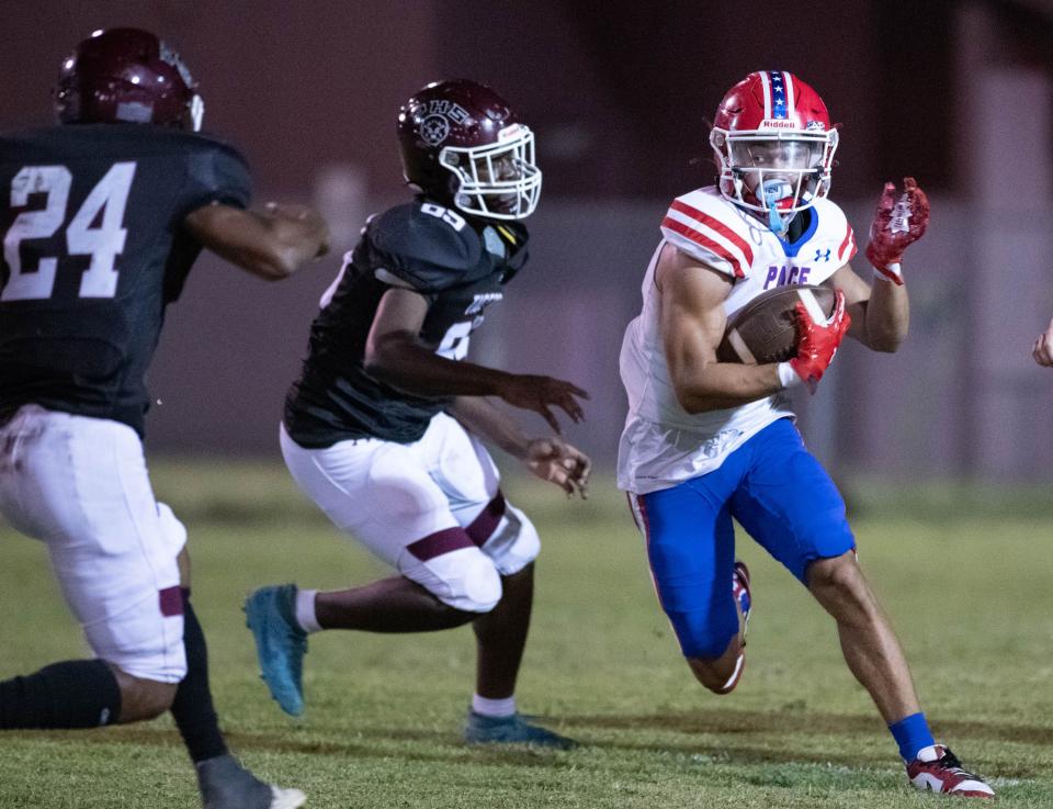 Xakery Wiedner (8) carries the ball during the Pace vs PHS football game at Pensacola High School on Thursday, Oct. 5, 2023.
