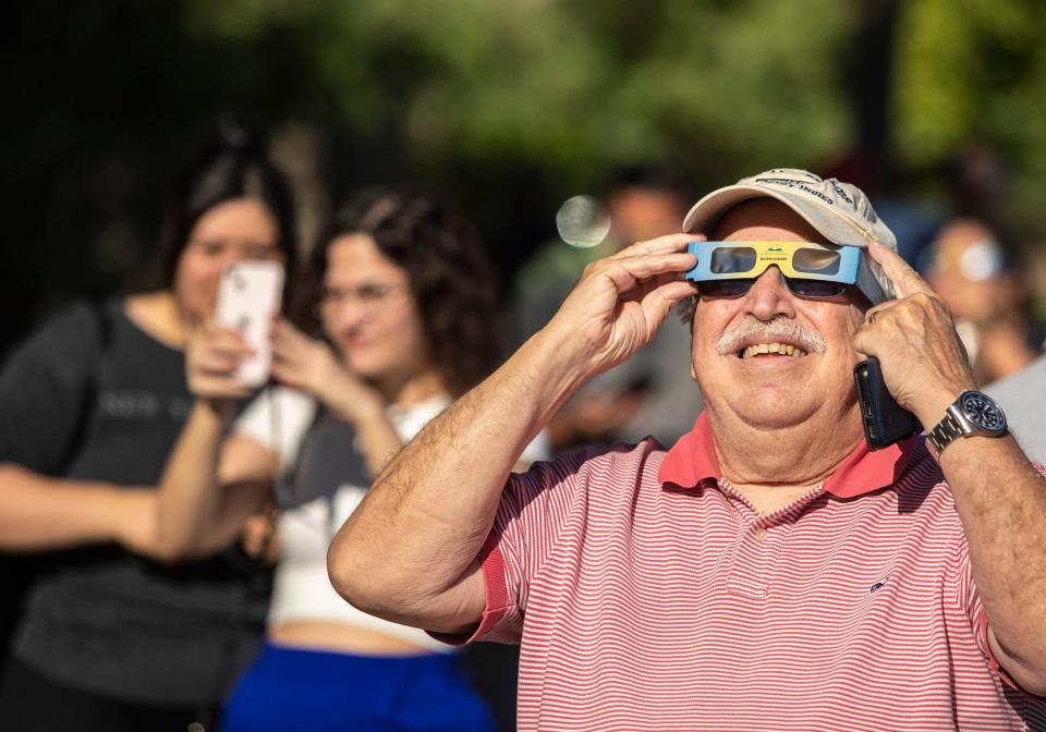 Dom Summa, a member of the Rancho Mirage Library & Observatory Advisory Commission, smiles while viewing the solar eclipse Saturday at Rancho Mirage Community Park.