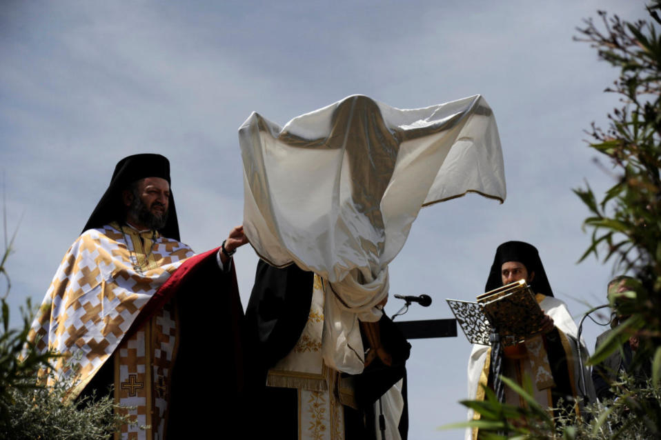 <p>Orthodox priests carry a shrouded figure of a crucified Jesus Christ during a ceremony reenacting Jesus Christ’s deposition from the cross on Good Friday at Penteli monastery, north of Athens, Greece, on April 29, 2016. <i>(Michalis Karagiannis/Reuters)</i></p>