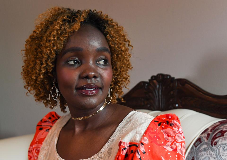 Achut Deng sits for a portrait in her living room on Friday, March 25, 2021, at her home in Sioux Falls.