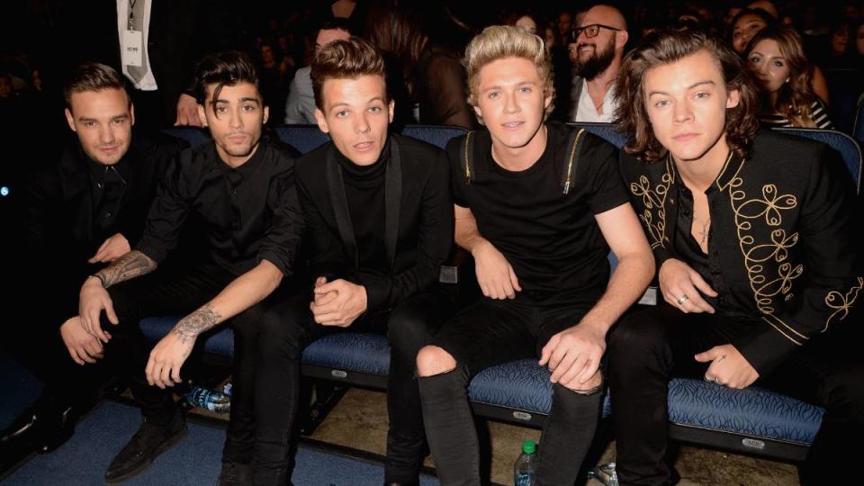 One Direction sitting in all black