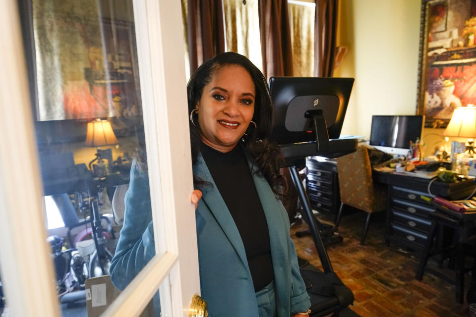 Ashley K. Shelton, executive director of Power Coalition for Equity & Justice in Louisiana, a voter advocacy organization that is trying to get left-leaning voters engaged for next year's elections, possess for a photo at her family home in Baton Rouge, La., Tuesday, Dec. 26, 2023. (AP Photo/Gerald Herbert)