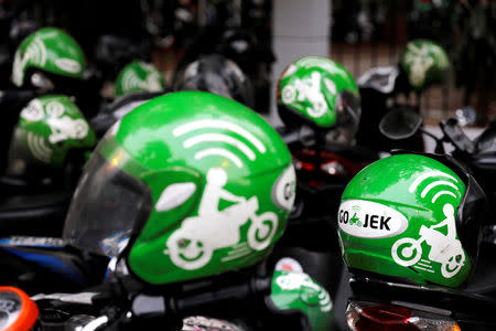 Gojek driver helmets are seen during Go-Food festival in Jakarta, Indonesia, October 27, 2018. Picture taken October 27, 2018. REUTERS/Beawiharta