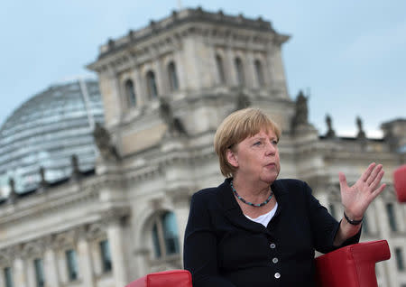 German Chancellor Angela Merkel talks during ARD summer-interview infront of the Reichstag in Berlin, Germany August 28, 2016. REUTERS/Stefanie Loos