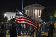 People gather at the Supreme Court in Washington, Saturday night, Sept. 19, 2020, to honor the late Justice Ruth Bader Ginsburg, one of the high court's liberal justices, and a champion of gender equality. Her death leaves a vacancy that could be filled with a more conservative justice by President Donald Trump. (AP Photo/J. Scott Applewhite)