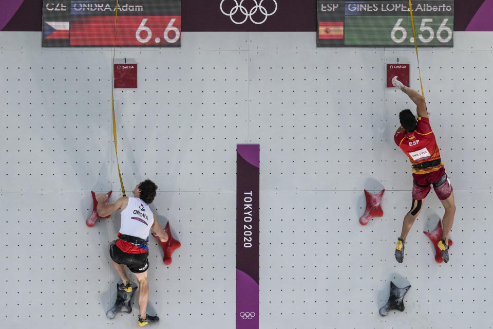 Czech Republic's Adam Ondra, left, and Alberto Gines Lopez, of Spain, compete during the speed portion of the men's sport climbing final at the 2020 Summer Olympics, Thursday, Aug. 5, 2021, in Tokyo, Japan. (AP Photo/Gregory Bull)