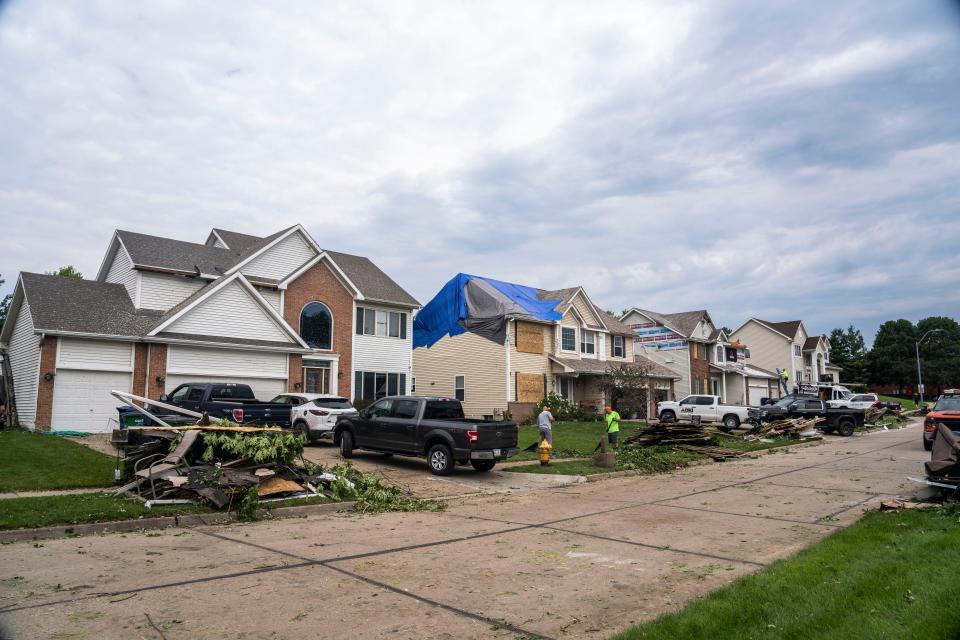 Property damage is seen on 80th Street on Tuesday, July, 16, 2024, in Urbandale after a tornado passed through the area the night before.