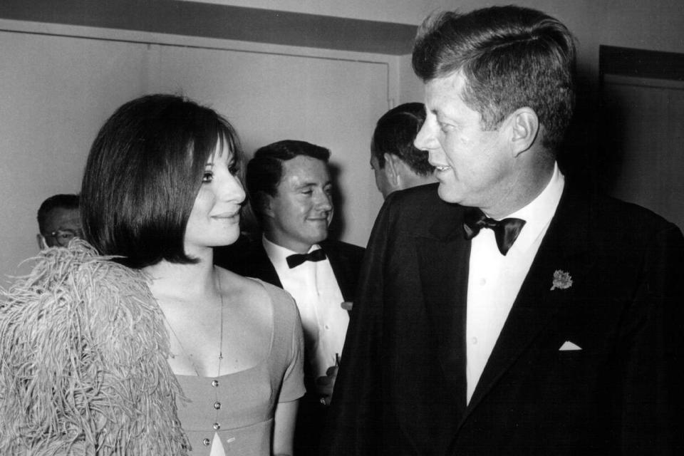 <p>National Archive/Newsmakers/Getty</p> Barbra Streisand speaks with President John F. Kennedy on May 24, 1963