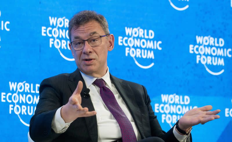 FILE PHOTO: Bourla, CEO of Pfizer gestures during a discussion at the World Economic Forum in Davos