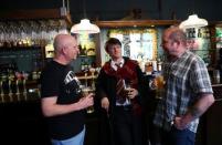 Professional Harry Potter impersonator Luke Williams (C) enjoys a drink at a pub in London, Britain, May 1, 2017. REUTERS/Neil Hall