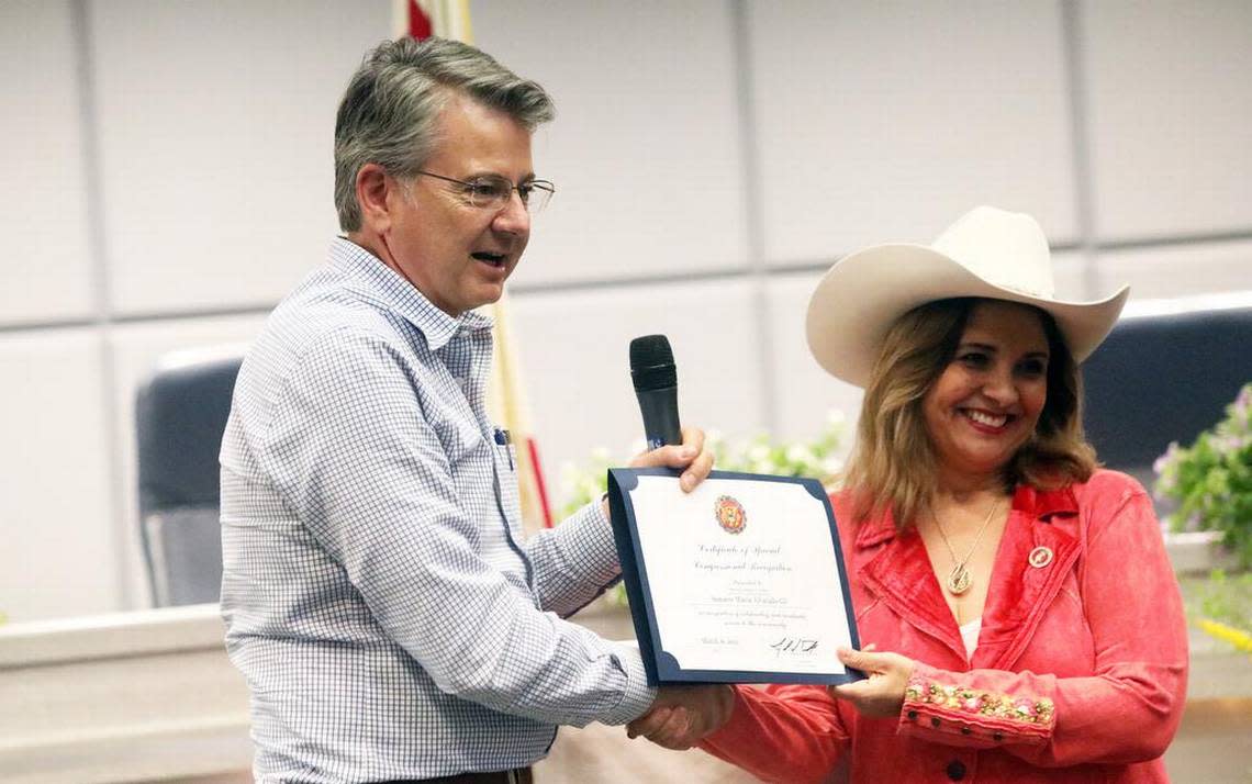 Congressmember John Duarte, R-Modesto, presents a certificate to state Sen. Marie Alvarado-Gil during her community swearing-in ceremony at the Modesto Irrigation District board room on March 16, 2023.