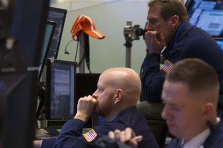 Traders work on the floor of the New York Stock Exchange January 24, 2014. REUTERS/Brendan McDermid